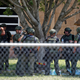 Law enforcement personnel stand outside Robb Elementary School following a shooting, May 24, 2022, in Uvalde, Texas.